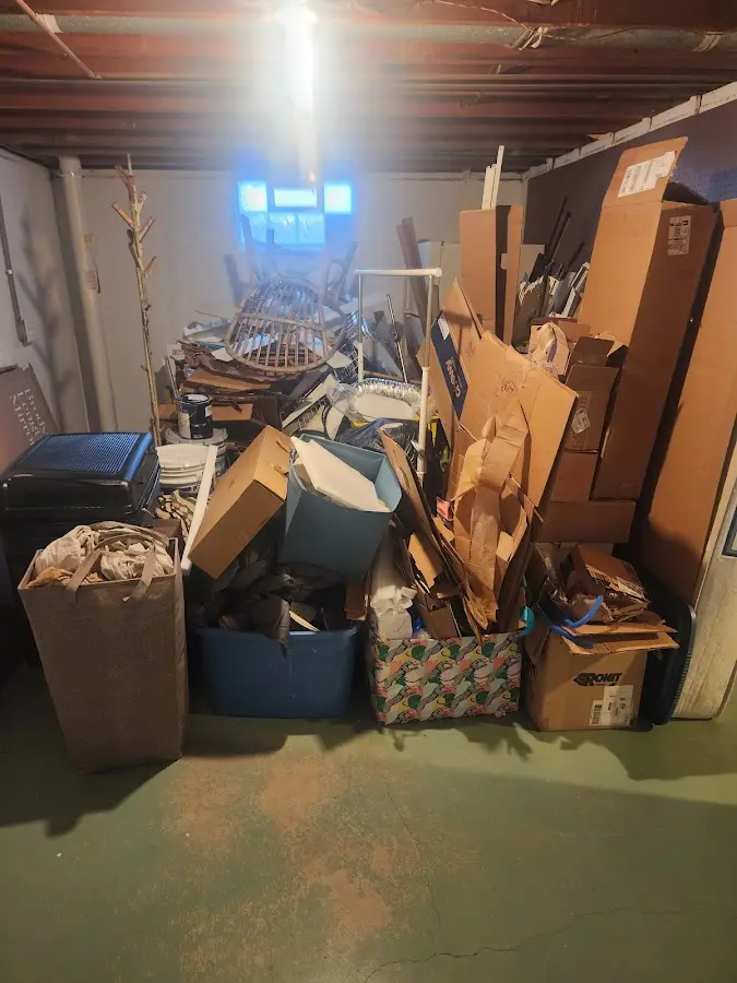 Roll-off dumpster container at job site for Concrete Dumpster Rental in Paola